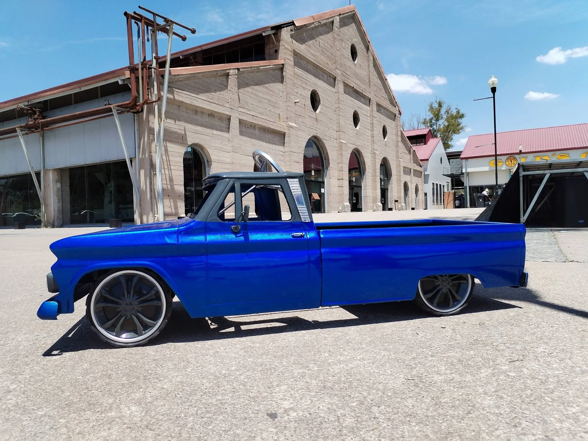 Candy blue custom lowrider slammed in plaza