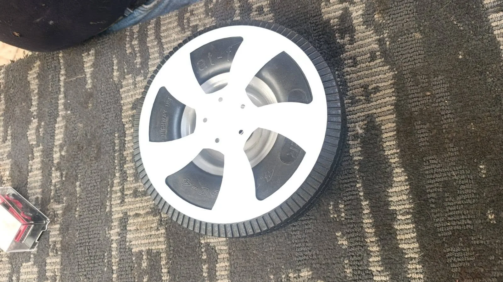 Custom directional billet wheel detail on slammed Chevy C1500 Red SS