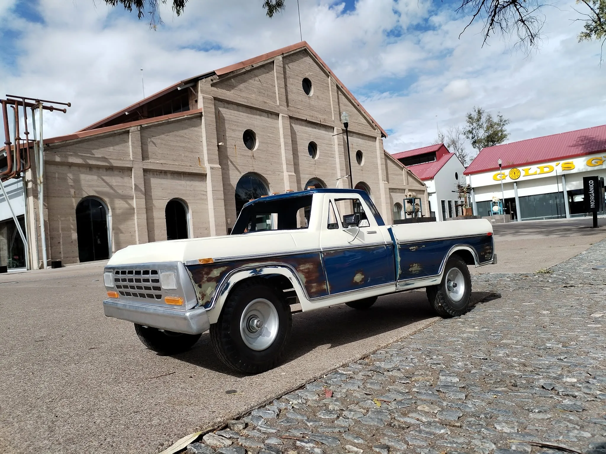 Vintage patina two-tone blue and white Ford F-100 miniature truck